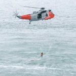 coast guard rescuing boat accident victim
